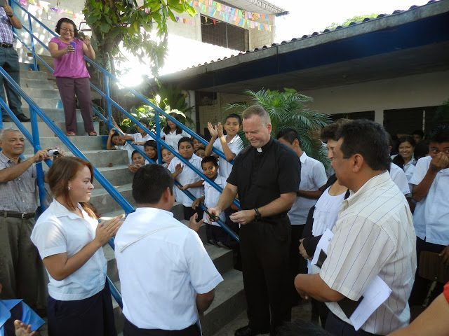 Father Keane officially blesses and dedicates the classrooms at Pablo VI